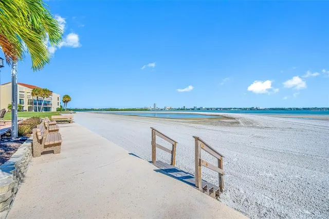 a view of a swimming pool with a lounge chairs
