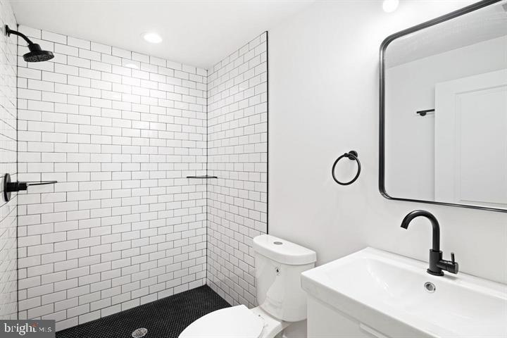 2322 Mutter Street Philadelphia, PA 19133 - Photo 14 of 34 a bathroom with a sink a toilet and shower