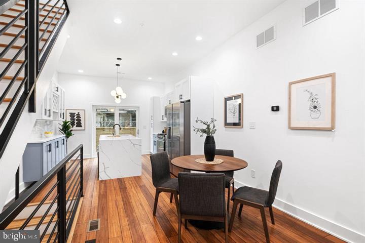 2322 Mutter Street Philadelphia, PA 19133 - Photo 16 of 34 a dining room with furniture and wooden floor