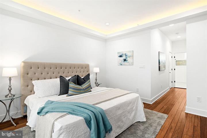 2322 Mutter Street Philadelphia, PA 19133 - Photo 28 of 34 a bedroom with a bed and wooden floor