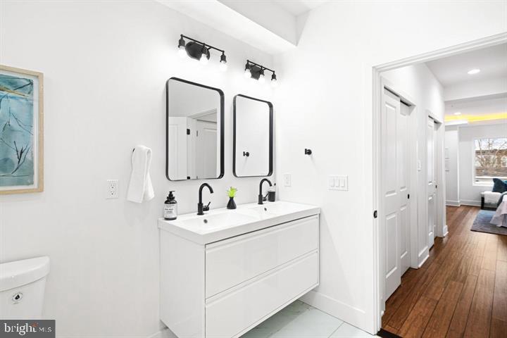 2322 Mutter Street Philadelphia, PA 19133 - Photo 31 of 34 a bathroom with a toilet sink and mirror
