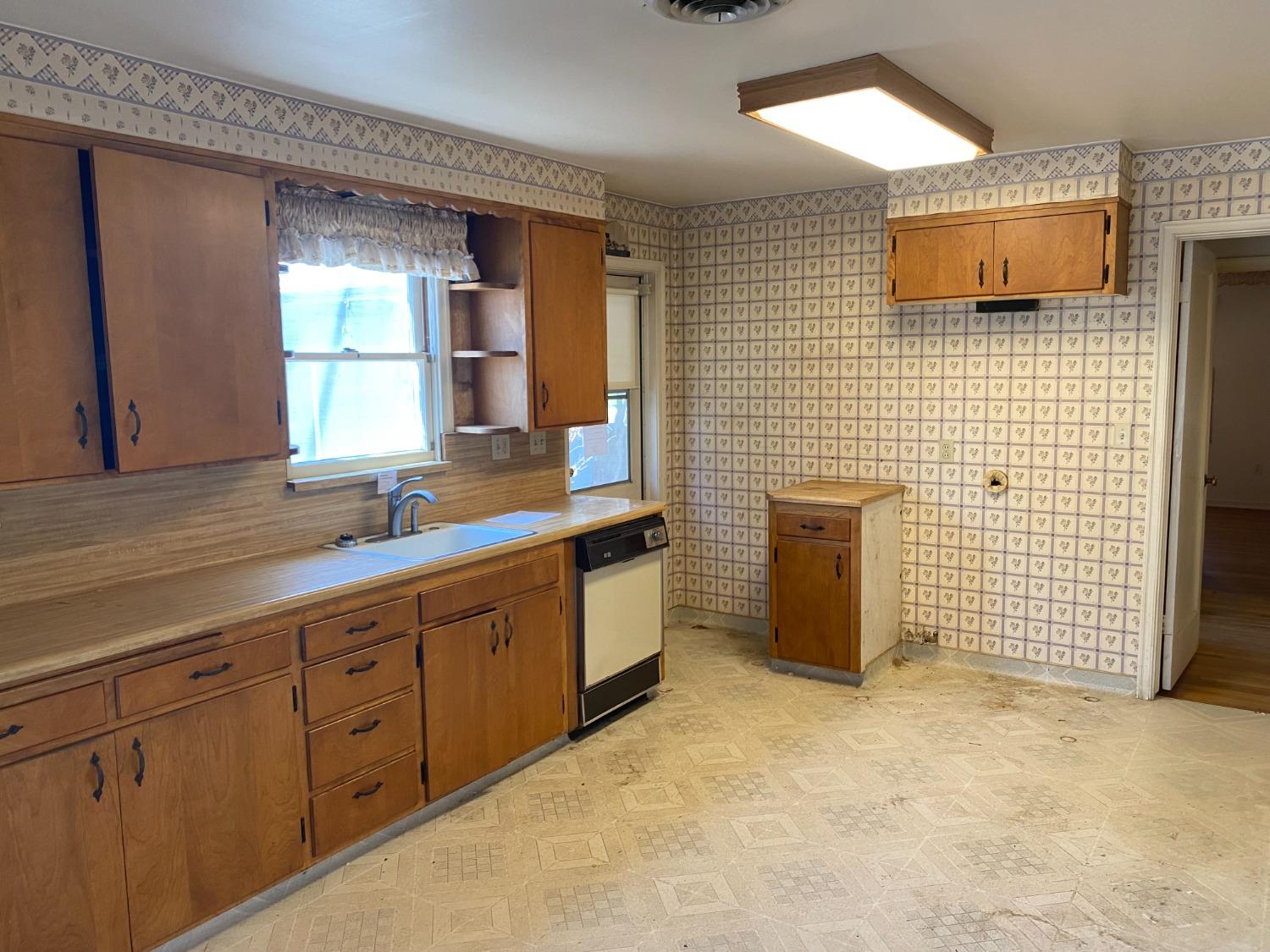 2828 E Street Selma, CA 93662 - Photo 6 of 17 a bathroom with a sink a vanity and mirror