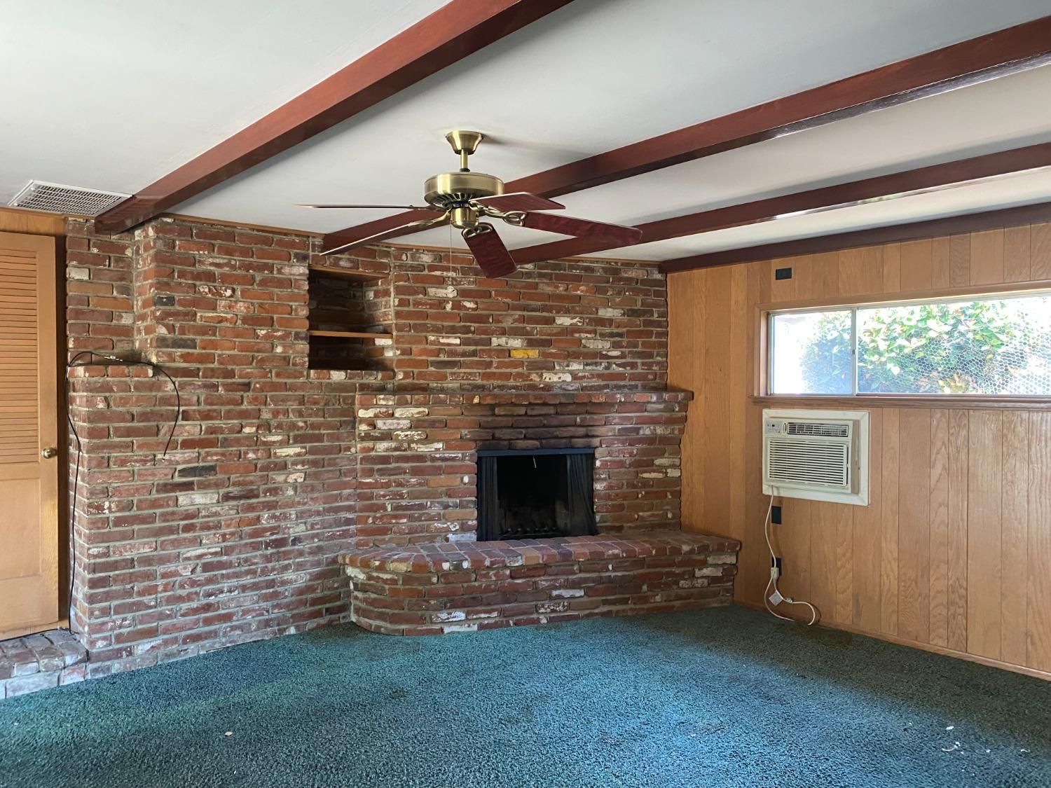 2828 E Street Selma, CA 93662 - Photo 10 of 17 a living room with a fireplace
