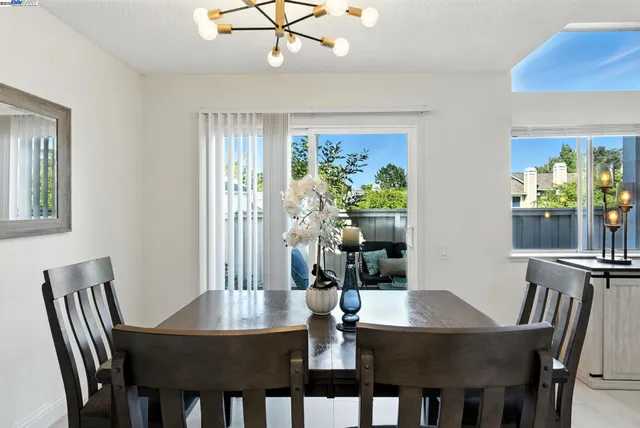 a view of a dining room with furniture window and outside view