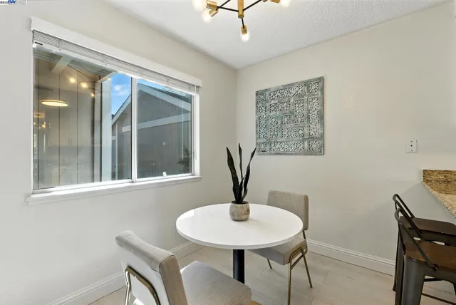 a view of a livingroom with furniture and window