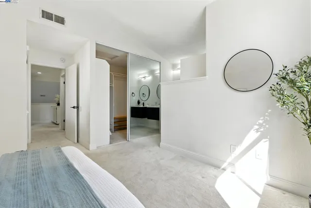 a view of a room with wooden floor and bathroom