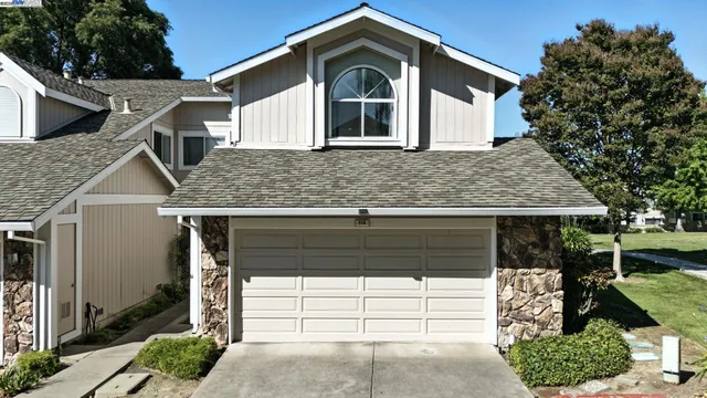 a front view of a house with a garage