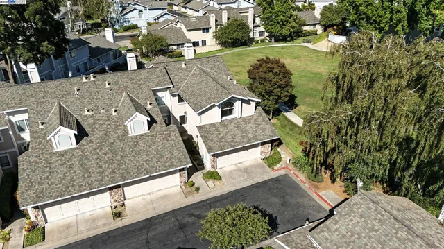 an aerial view of a house with outdoor space