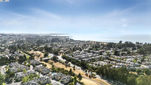 an aerial view of residential house with yard
