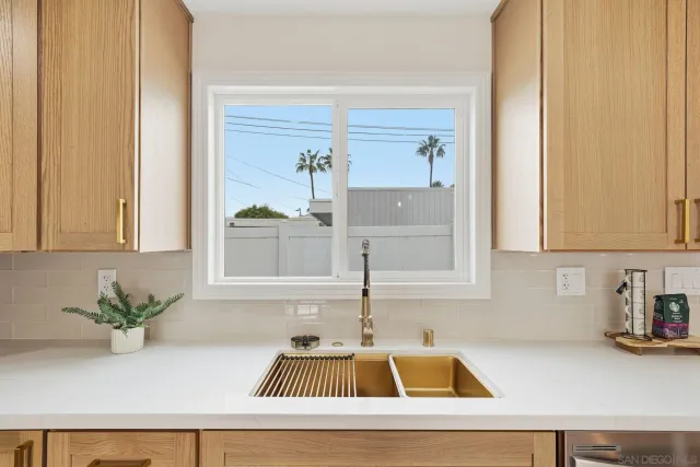 a kitchen with a sink and a window