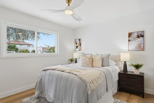 a bedroom with bed and a window