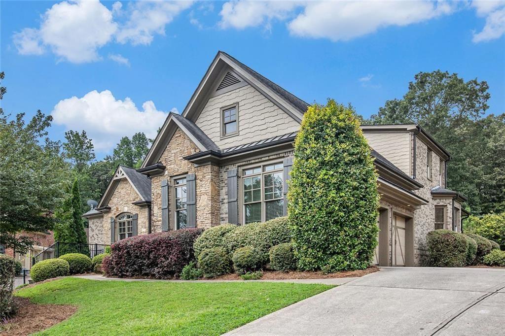 2953 Springbluff Lane Buford, GA 30519 - Photo 1 of 1 a view of house with garden and tall trees