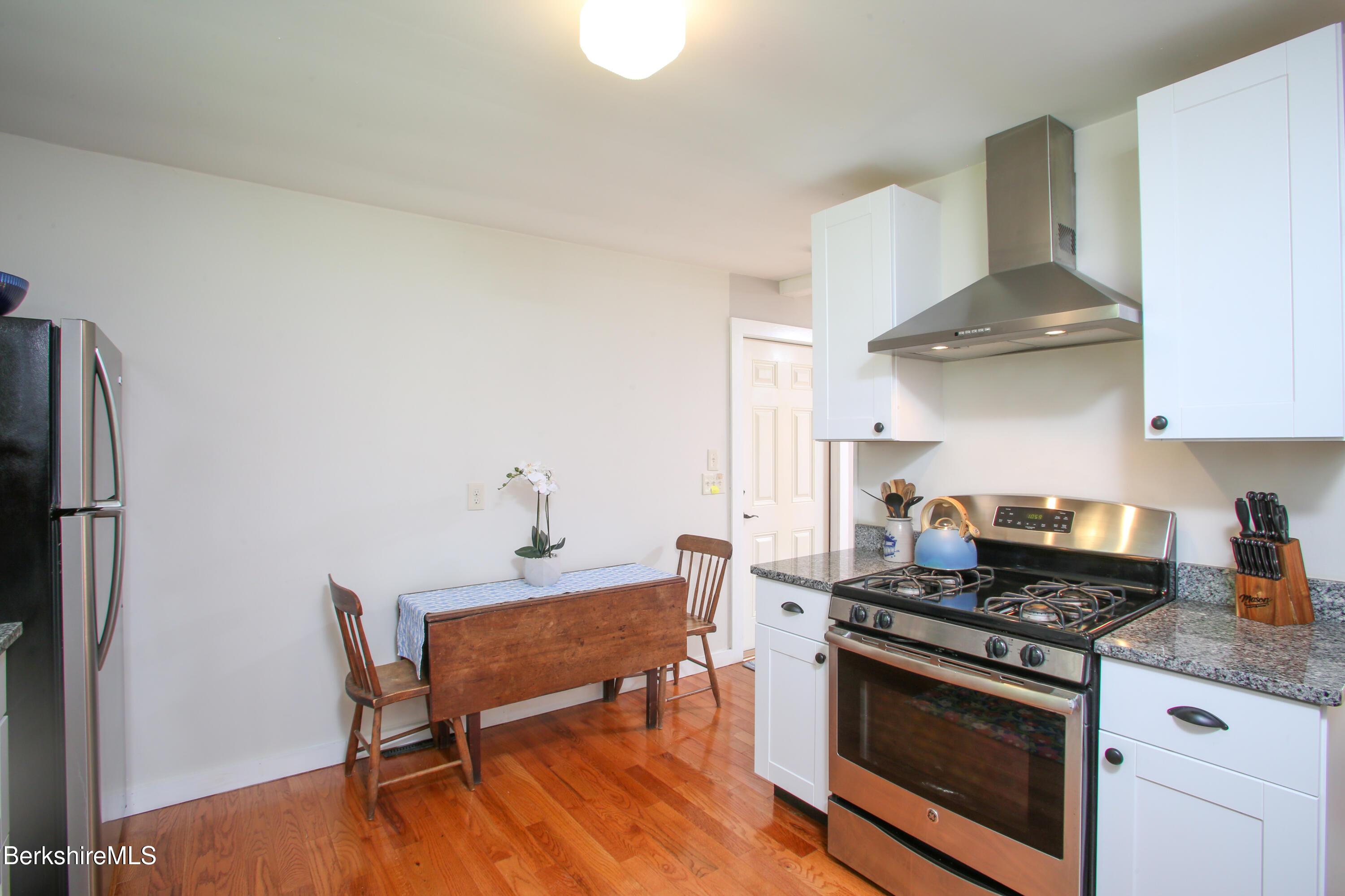 127 County Road Rowe, MA 01367 - Photo 13 of 29 a kitchen with stainless steel appliances a stove a sink and a refrigerator