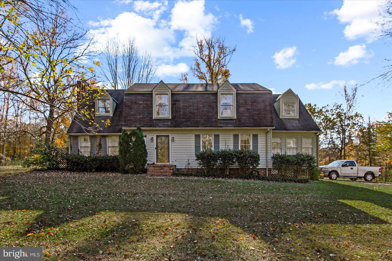 316 Copper Line Road Bumpass, VA 23024 - Photo 2 of 77 a front view of a house with garden