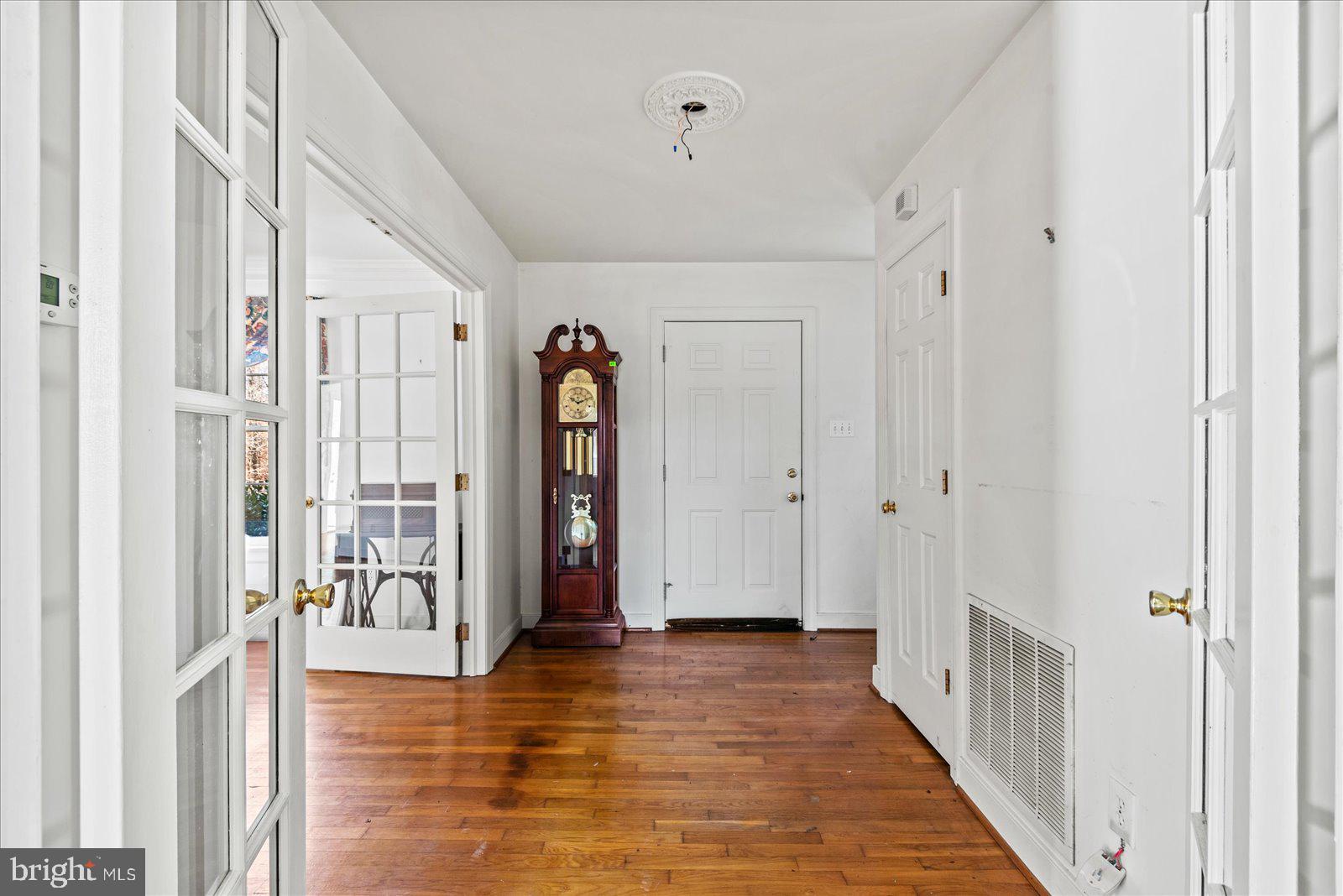 316 Copper Line Road Bumpass, VA 23024 - Photo 46 of 77 a view of a hallway with wooden floor and entryway