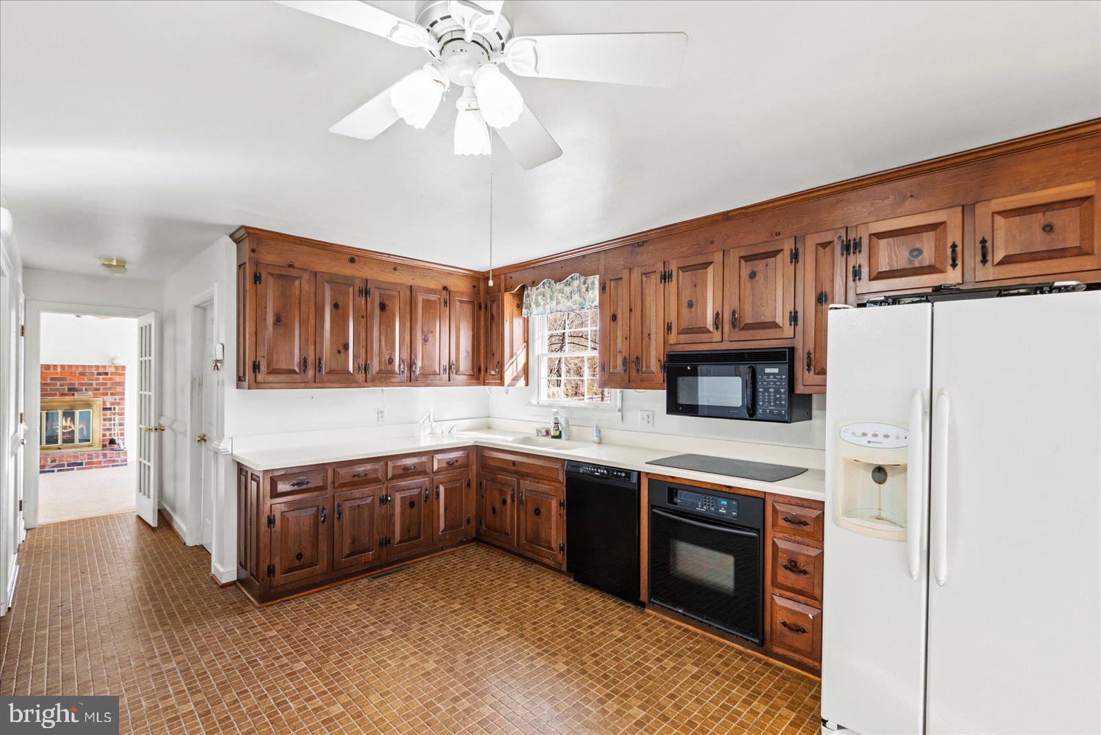 316 Copper Line Road Bumpass, VA 23024 - Photo 49 of 77 a kitchen with stainless steel appliances granite countertop a sink and cabinets