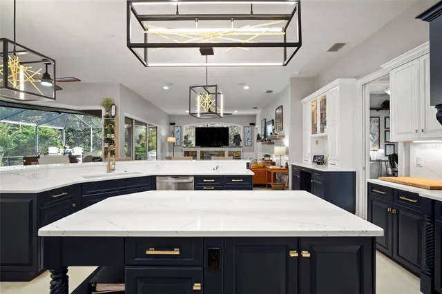 a large kitchen with a table and chairs