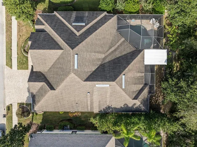 an aerial view of houses with outdoor space