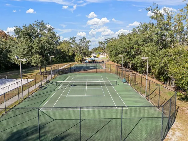a view of a swimming pool with an outdoor space and seating area