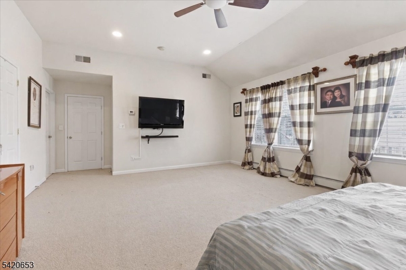 26 Eldora Road Parsippany, NJ 07054 - Photo 29 of 47 a view of a livingroom with furniture and a flat screen tv