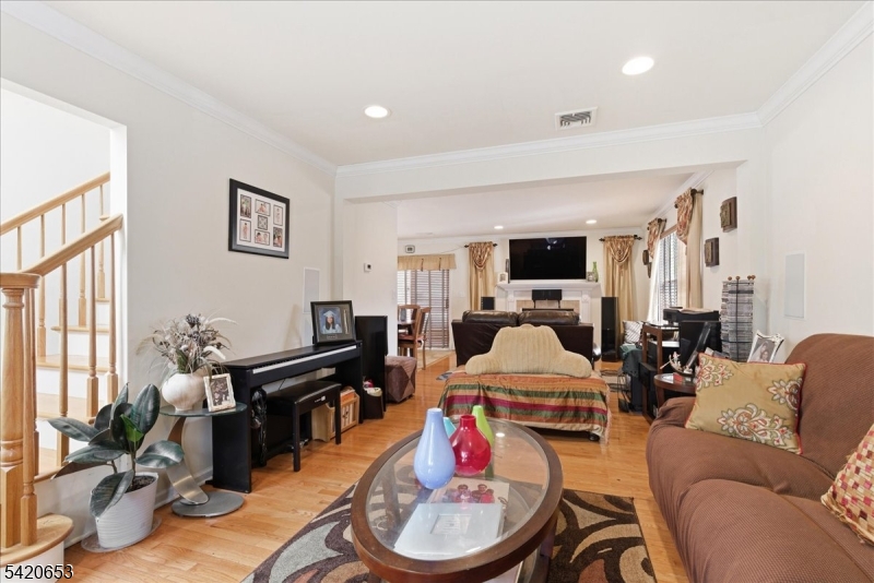 26 Eldora Road Parsippany, NJ 07054 - Photo 7 of 47 a living room with furniture flat screen tv and a window