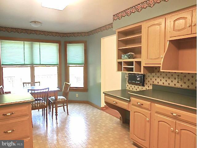 5130 Fox Tower Road Smithsburg, MD 21783 - Photo 18 of 30 a dining hall with stainless steel appliances granite countertop a stove and a dining table with granite countertops