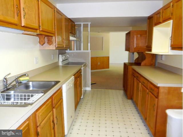 5130 Fox Tower Road Smithsburg, MD 21783 - Photo 20 of 30 a kitchen with stainless steel appliances granite countertop a sink and cabinets