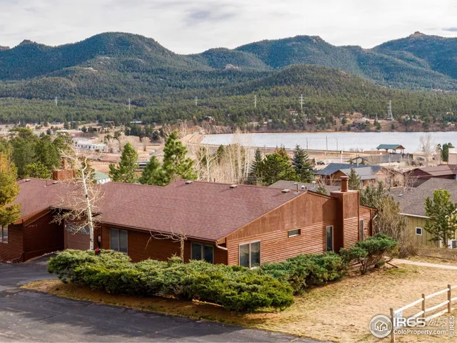 an aerial view of house with mountain view