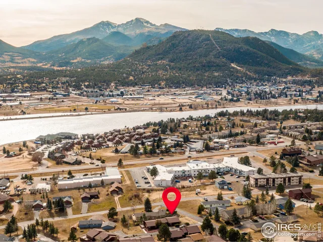 an aerial view of residential houses and city view