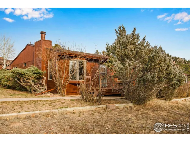 a view of multiple houses with a street