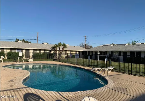 a view of a swimming pool with a patio