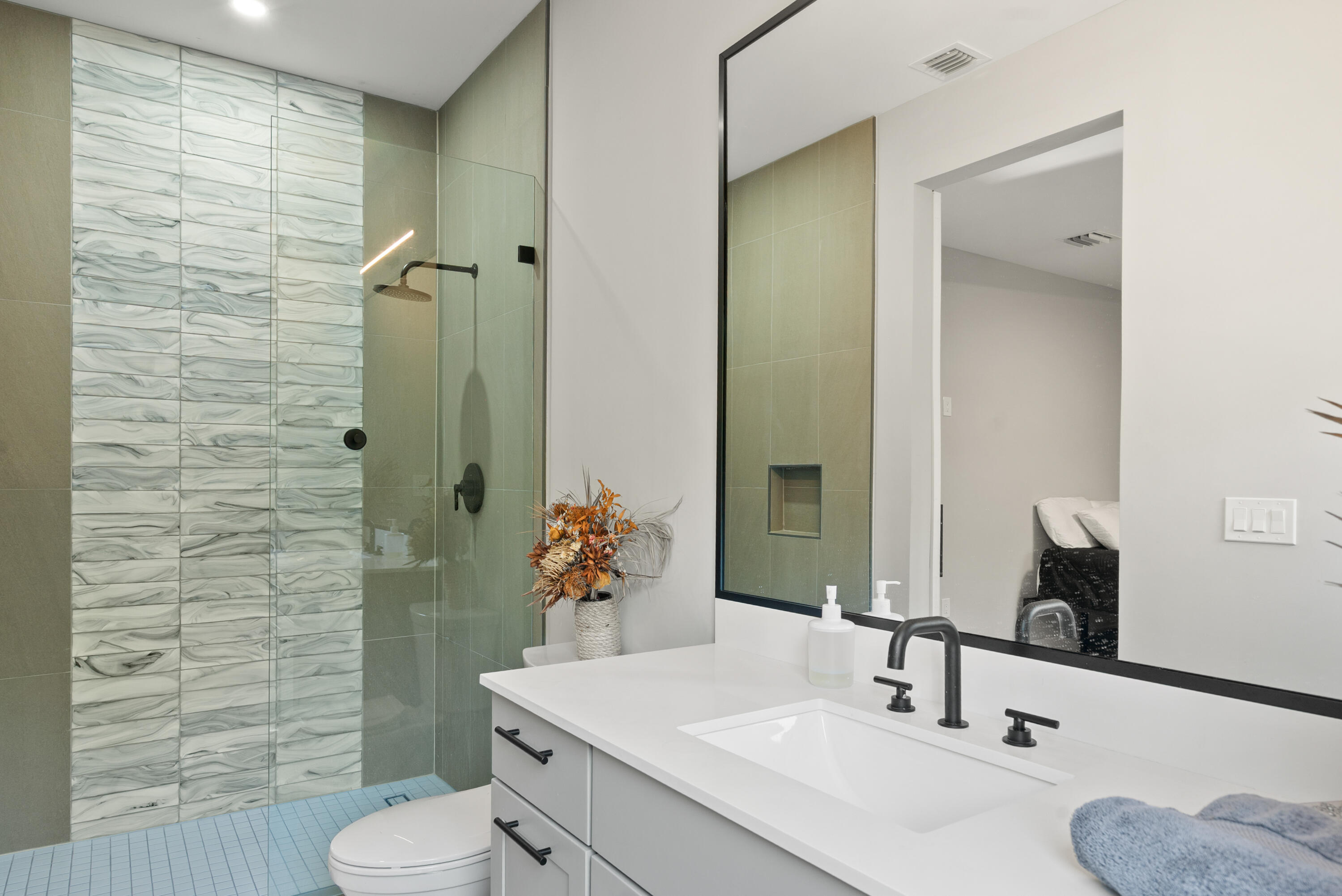 13 Coral Way Key Largo, FL 33037 - Photo 16 of 34 a bathroom with a sink toilet and shower