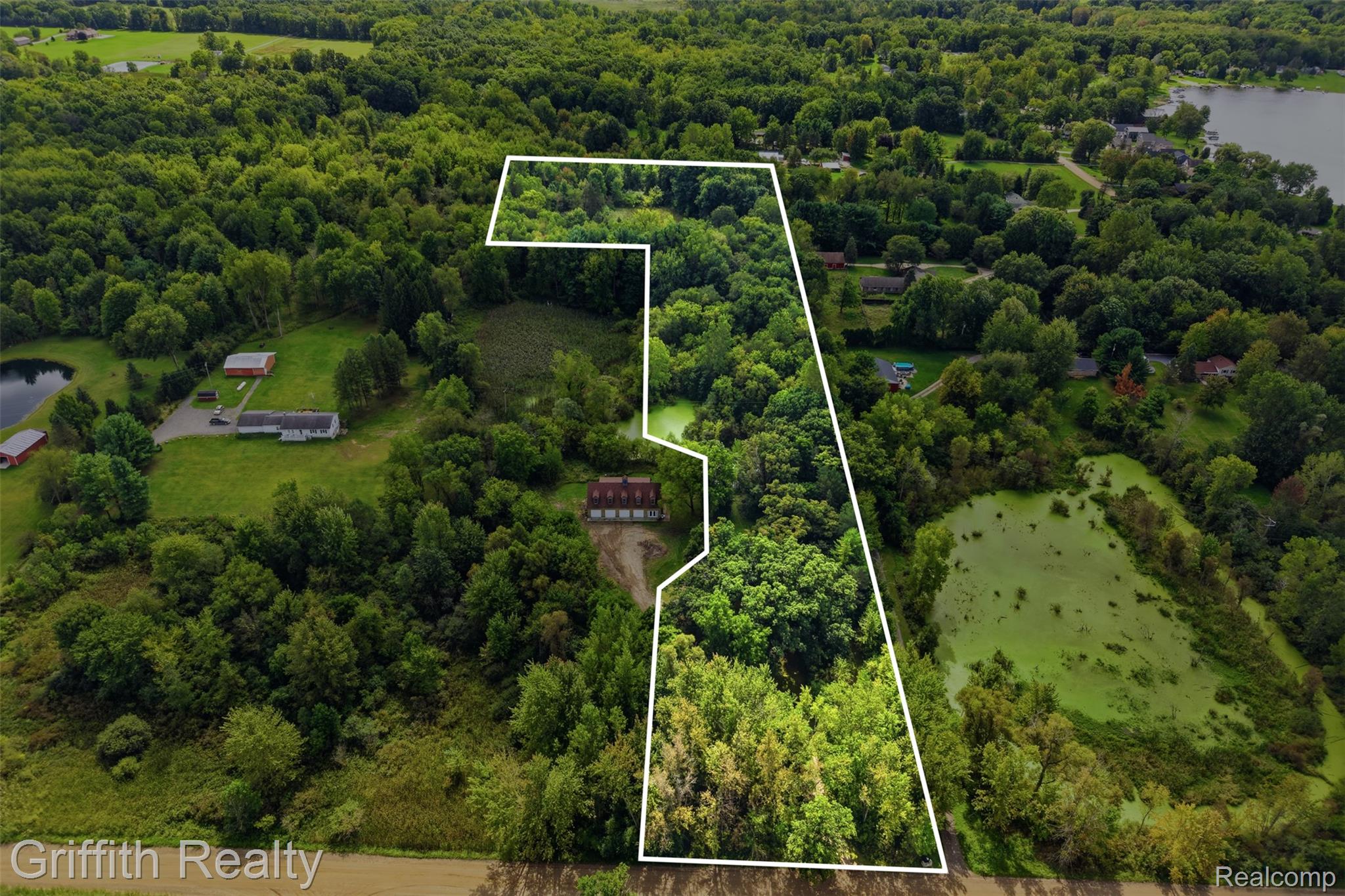 12300 Holtforth Road Fenton, MI 48430 - Photo 37 of 45 Expansive wooded acreage featuring a large pond and an additional smaller pond