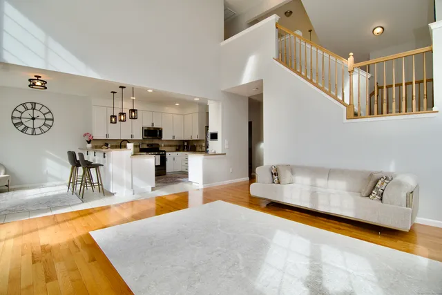 a living room with furniture and a table