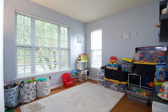 a children room with toys and a wooden floor
