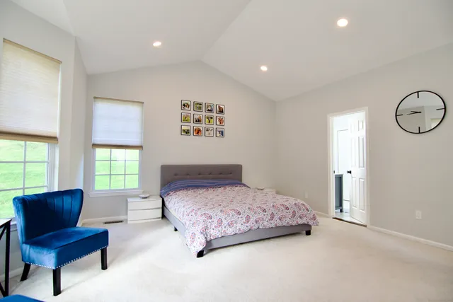 a bedroom with a bed and a couch