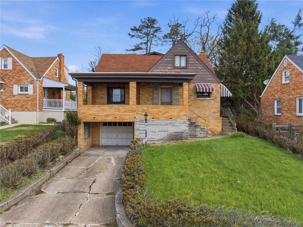138 Enger Avenue Pittsburgh, PA 15214 - Photo 1 of 50 a front view of a house with a garden