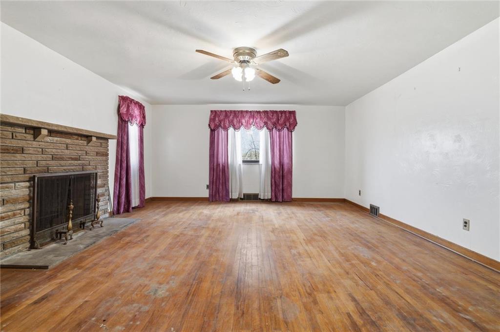 138 Enger Avenue Pittsburgh, PA 15214 - Photo 11 of 50 an empty room with windows and fireplace