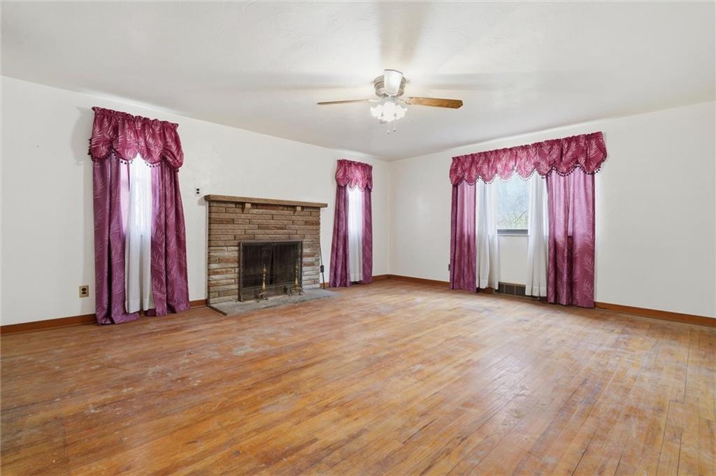 138 Enger Avenue Pittsburgh, PA 15214 - Photo 12 of 50 a view of an empty room with window and fireplace