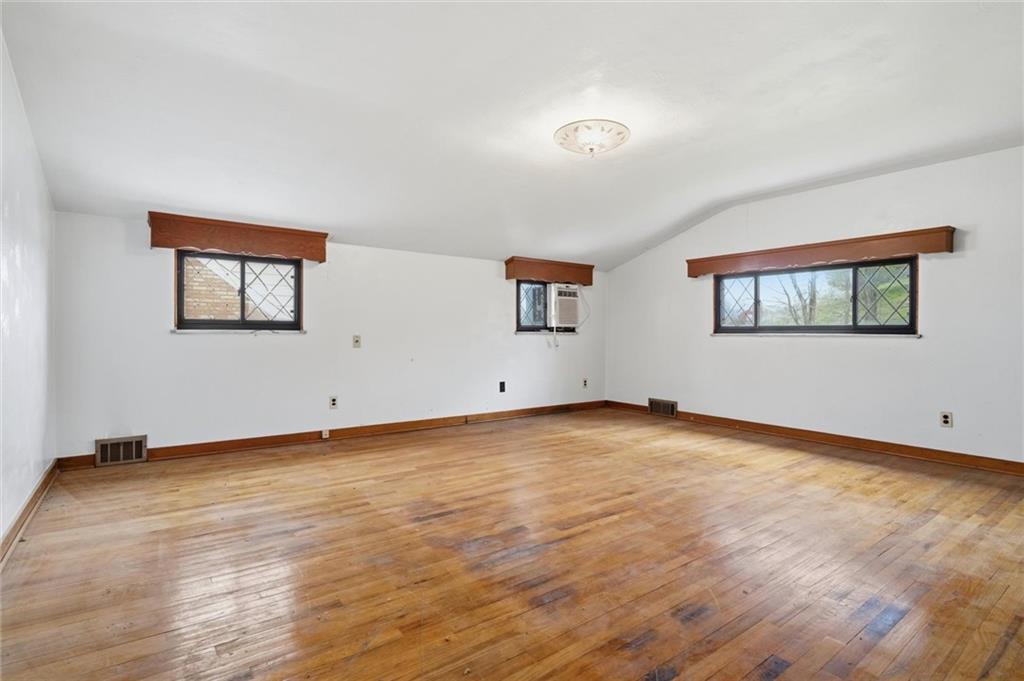 138 Enger Avenue Pittsburgh, PA 15214 - Photo 20 of 50 a view of a room with wooden floor and window