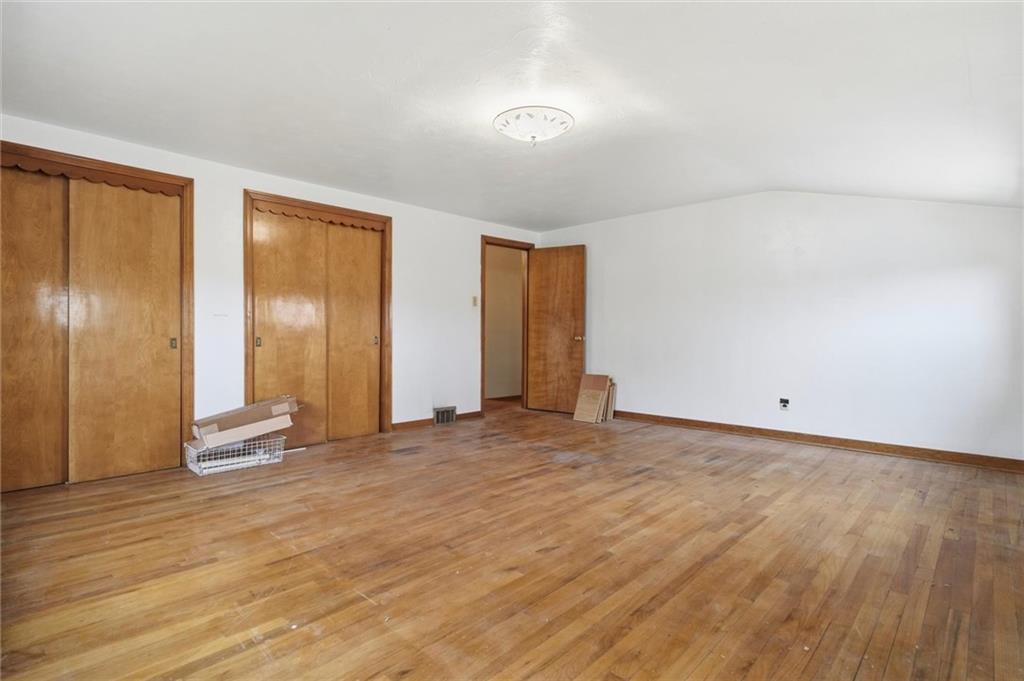138 Enger Avenue Pittsburgh, PA 15214 - Photo 21 of 50 a view of an empty room with wooden floor and a window