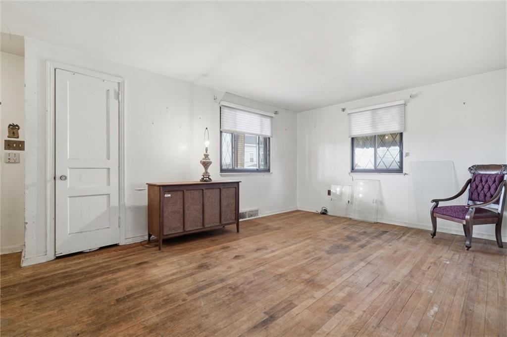138 Enger Avenue Pittsburgh, PA 15214 - Photo 3 of 50 a view of an empty room with wooden floor and a window