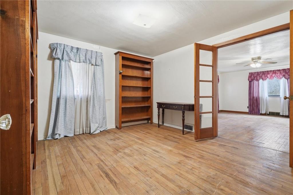 138 Enger Avenue Pittsburgh, PA 15214 - Photo 9 of 50 a view of a room with wooden floor and windows
