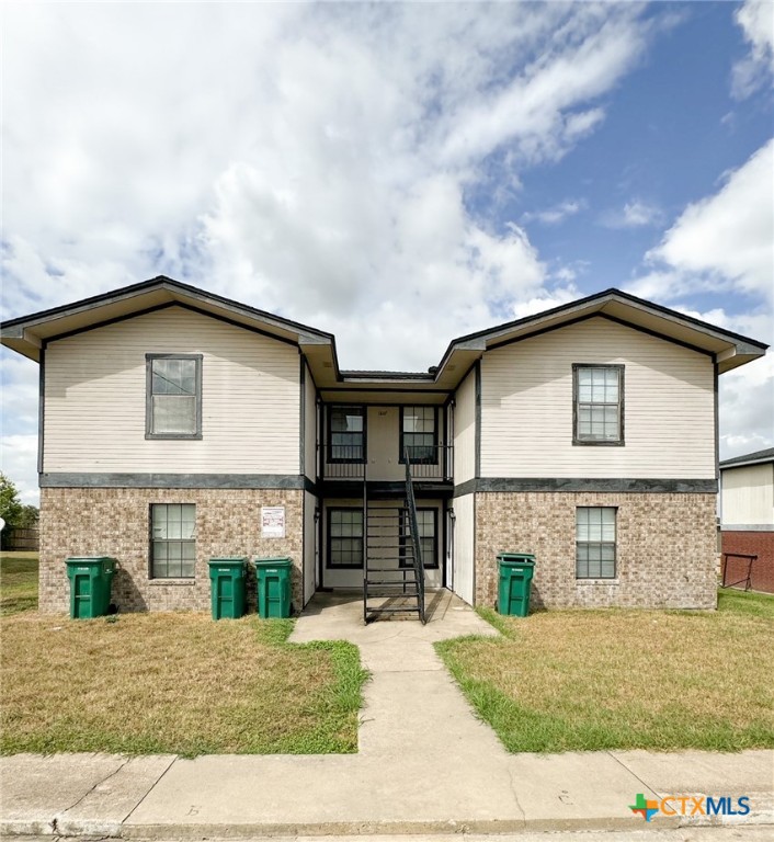 1807 Pontotoc Trace, Unit D Harker Heights, TX 76548 - Photo 1 of 1 a front view of a house with a yard and garage