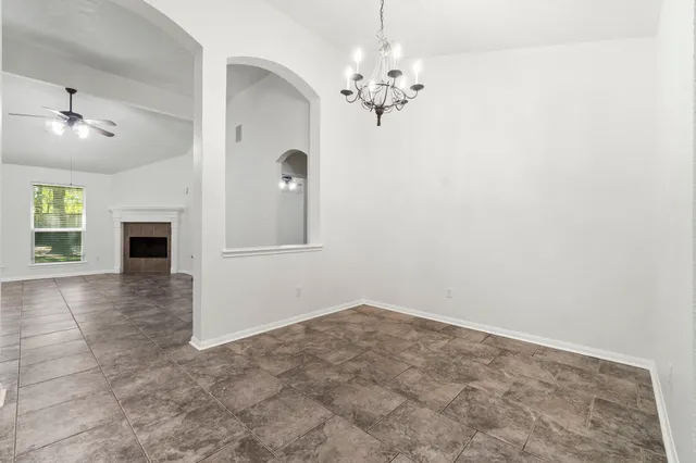 a view of an empty room with a fireplace