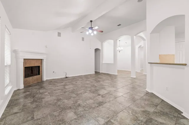 a view of a kitchen with granite countertop cabinets and a fireplace