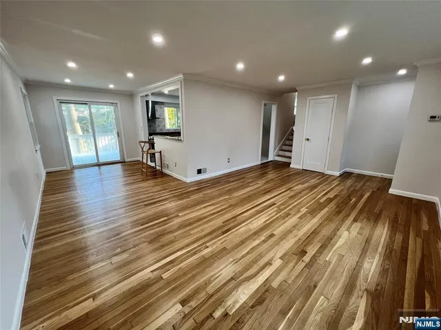 a kitchen with a stove a sink and a refrigerator