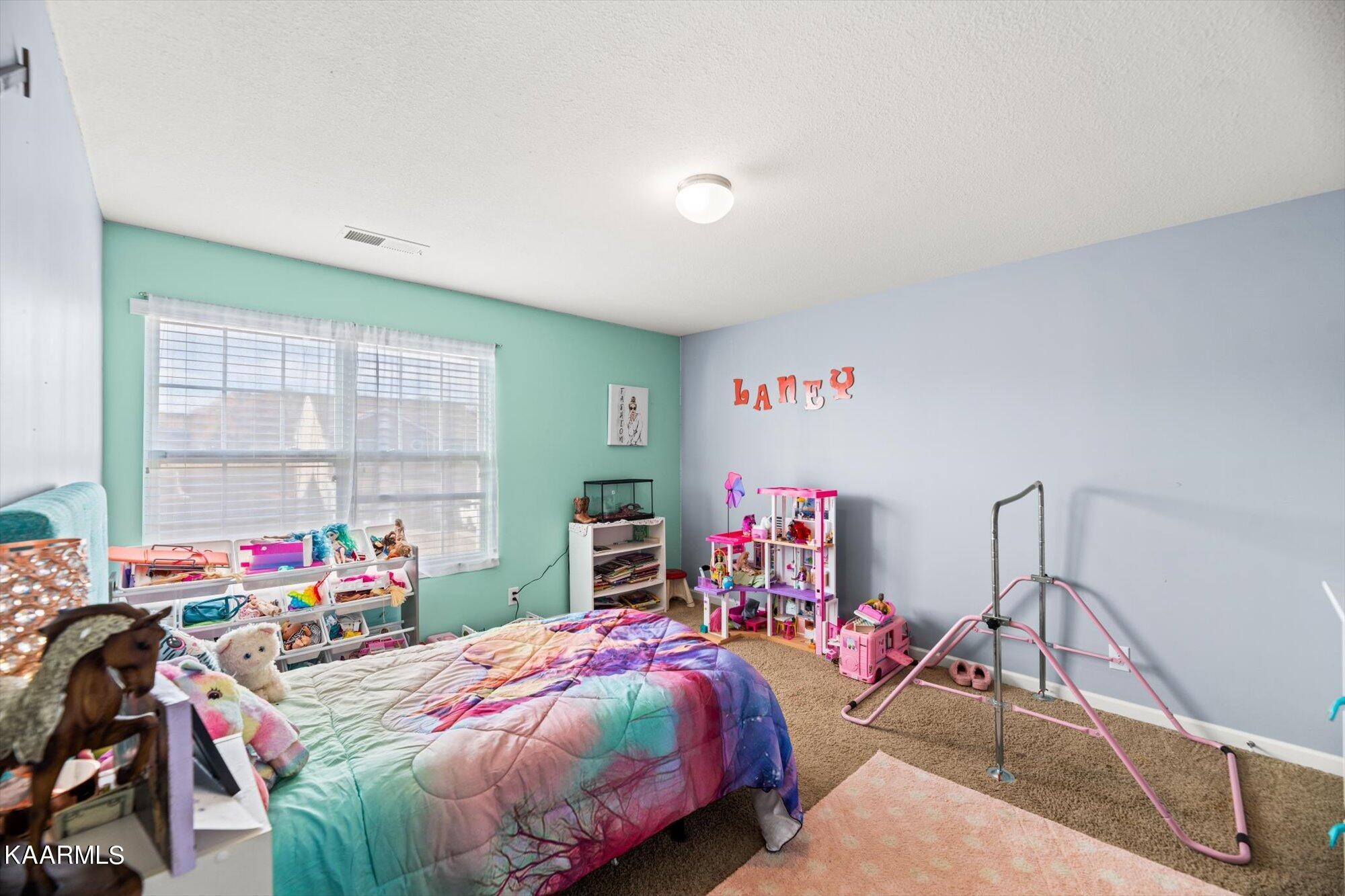 7136 Lawgiver Circle Corryton, TN 37721 - Photo 11 of 12 a bedroom with bed and a window