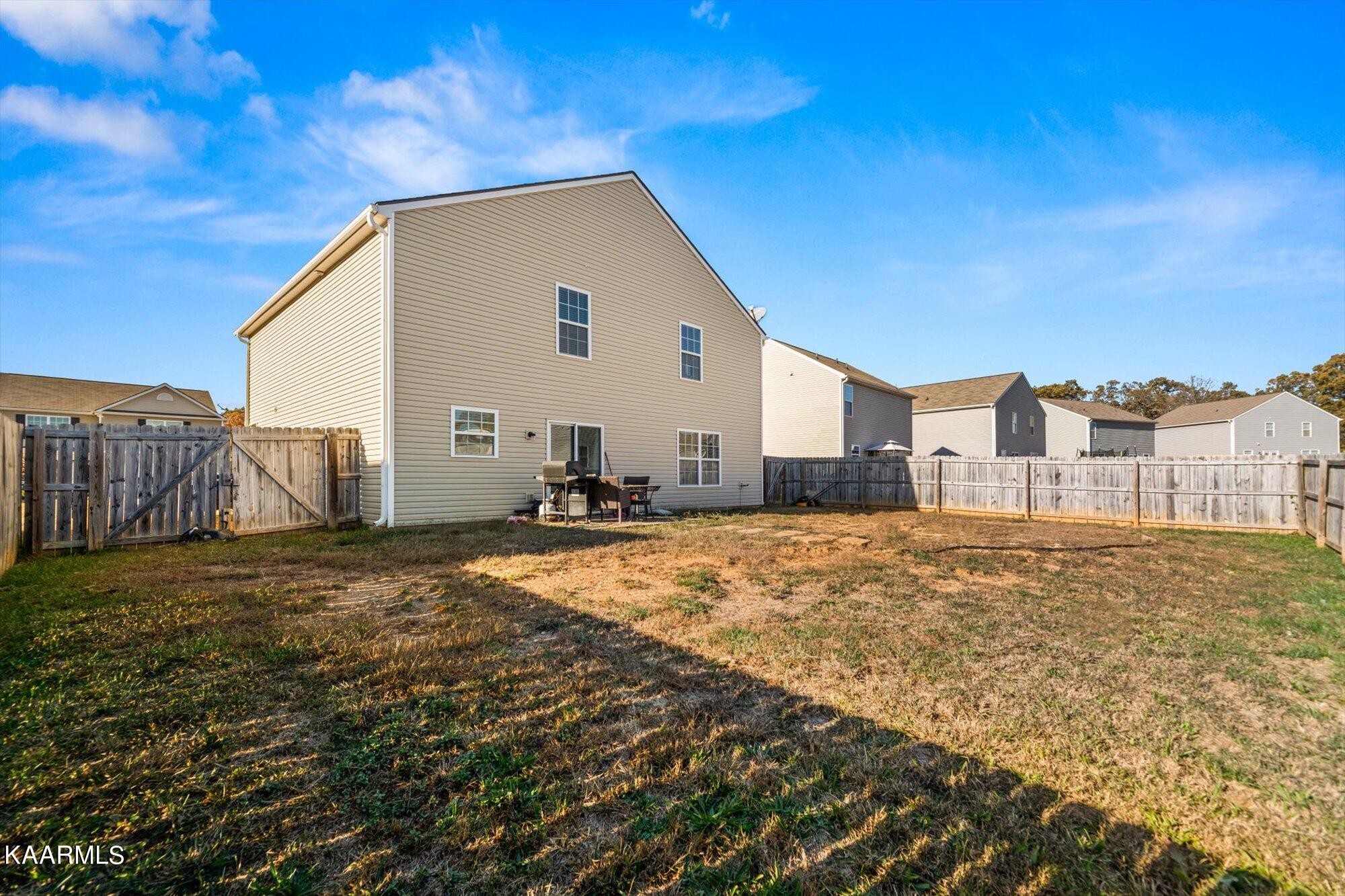 7136 Lawgiver Circle Corryton, TN 37721 - Photo 12 of 12 a view of a house with backyard and wooden fence