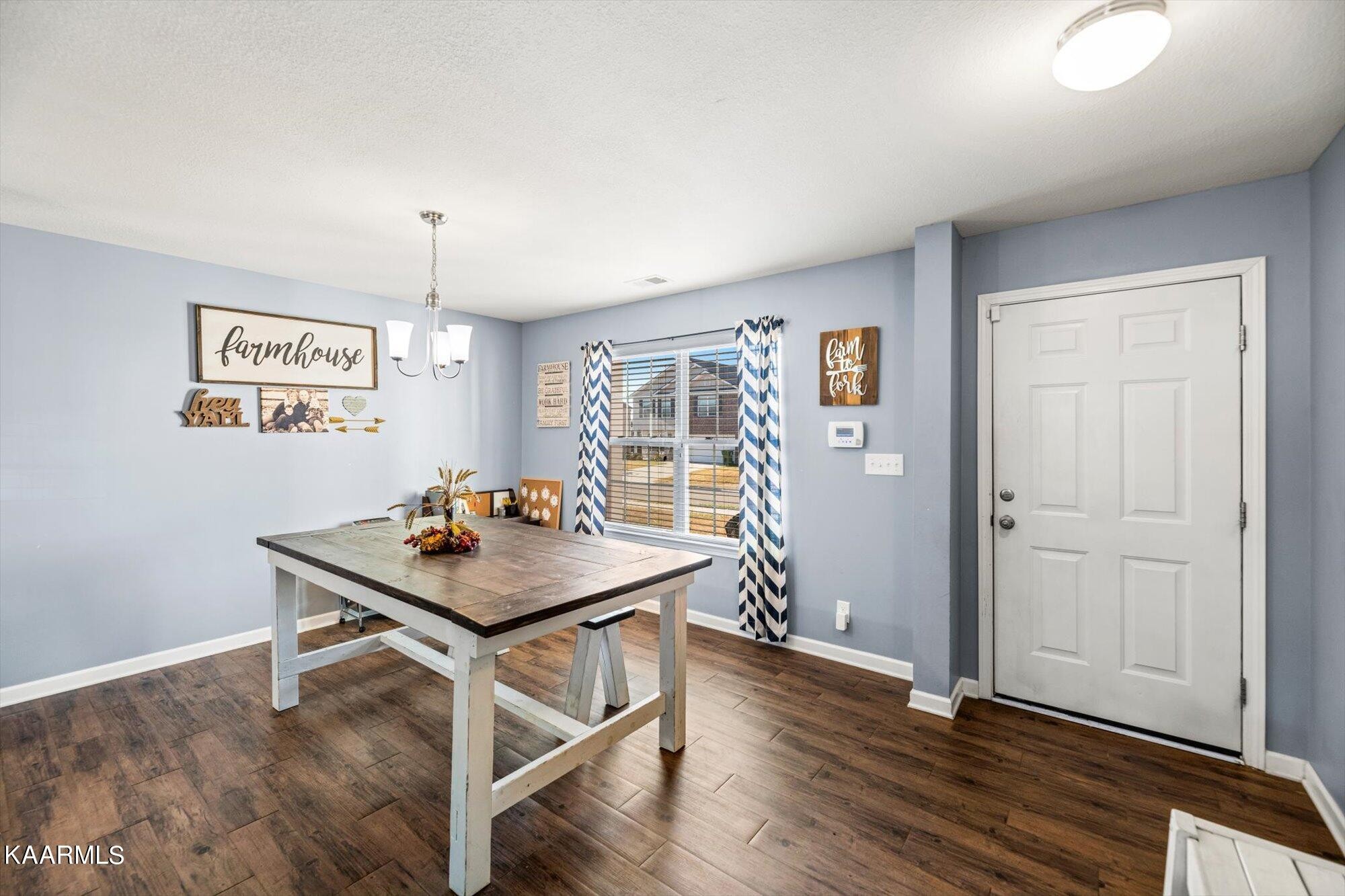 7136 Lawgiver Circle Corryton, TN 37721 - Photo 2 of 12 a room with furniture and wooden floor